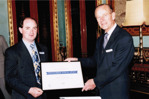 Charles R Marshall receiving a business award from Prince Phillip.